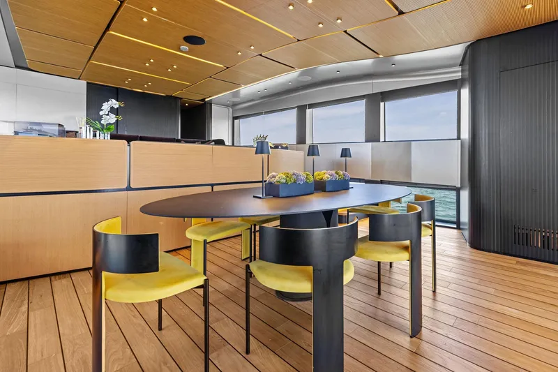 Slide: The Image of Luxurious interior of 2023 Wally WHY 150 yacht with modern dining area and ocean view. - 52