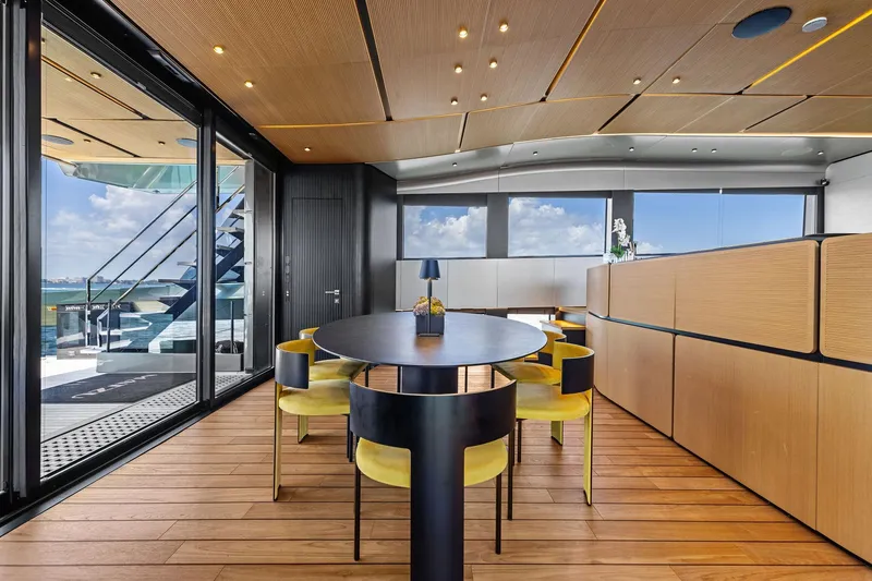 Slide: The Image of Luxurious interior of 2023 Wally WHY 150 yacht with modern dining area and ocean view. - 53