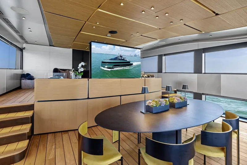 Slide: The Image of Luxurious interior of 2023 Wally WHY 150 yacht with modern dining area and sea view. - 58
