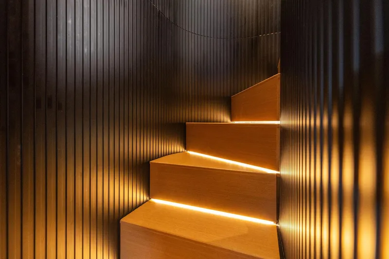 Slide: The Image of Modern staircase with ambient lighting on a 2023 Wally WHY 150 yacht. - 62