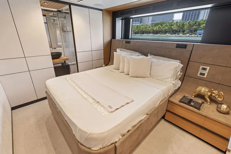 Slide: The Image of Luxurious bedroom interior of 2023 Wally WHY 150 yacht with elegant decor and scenic window view. - 63