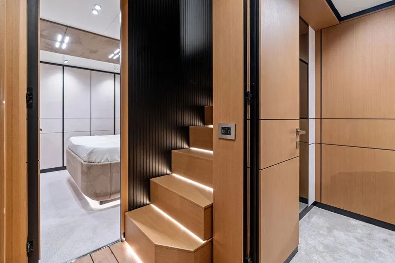 Slide: The Image of Modern interior of 2023 Wally WHY 150 yacht with sleek wooden stairs and bedroom. - 65