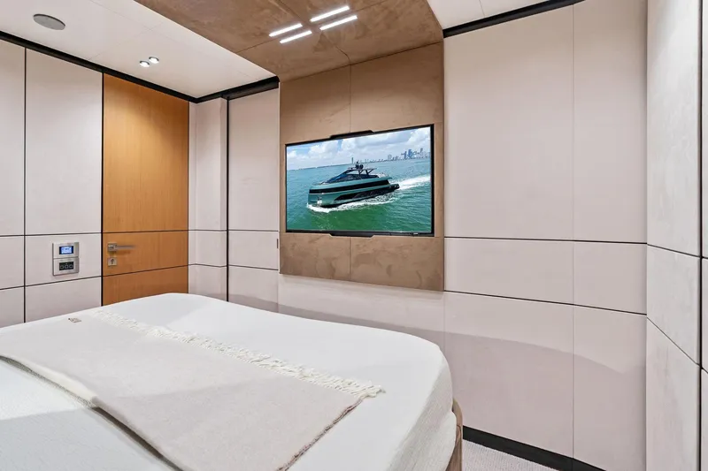 Slide: The Image of Luxurious interior of 2023 Wally WHY 150 yacht with modern bedroom and TV display. - 70