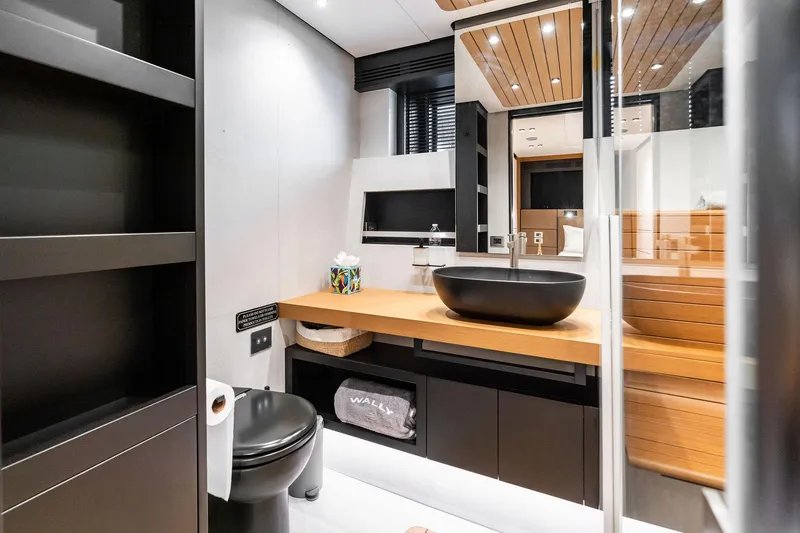 Slide: The Image of Modern bathroom interior on 2023 Wally WHY 150 yacht, featuring sleek design and wooden accents. - 71