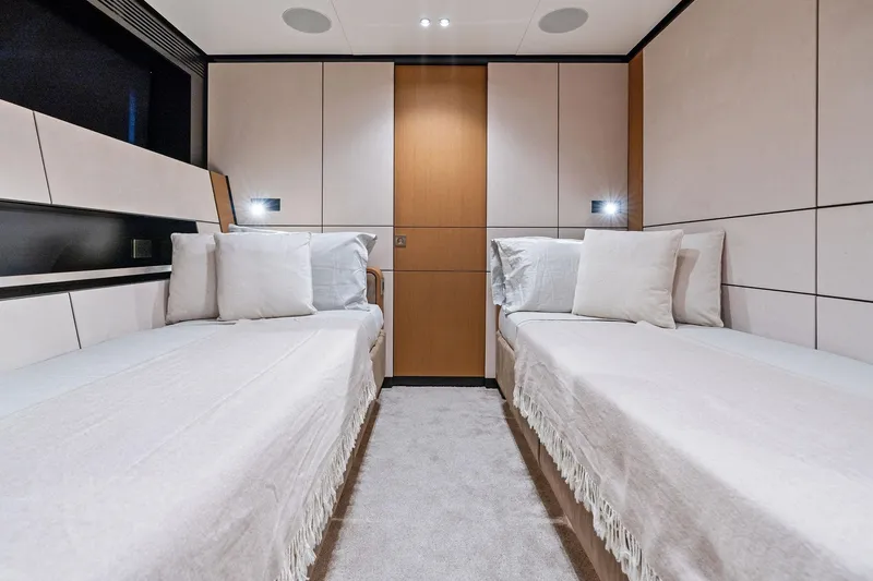 Slide: The Image of Luxurious twin cabin interior of 2023 Wally WHY 150 yacht, featuring modern design and cozy bedding. - 81