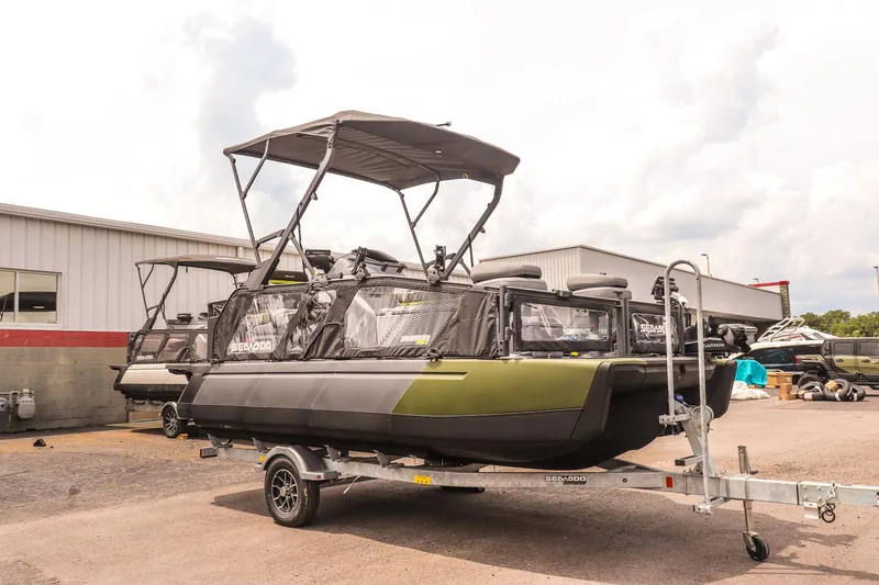 The Image of 2025 Sea-Doo Switch Fish 18-230 HP on trailer, parked outdoors near a building. - 1