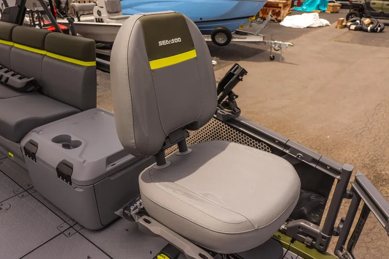 Slide: The Image of 2025 Sea-Doo Switch Fish 18-230 HP boat seat with storage and cup holder. - 18