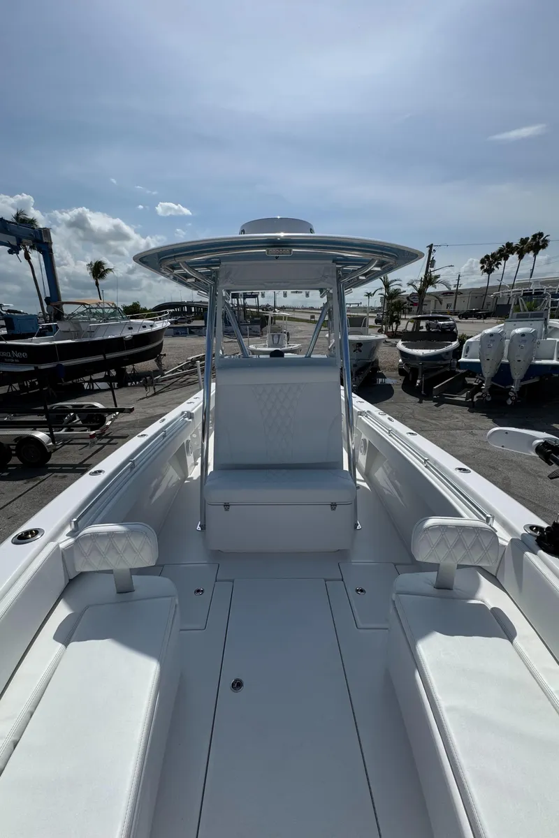 Slide: The Image of 2024 Contender 28 Tournament boat with sleek white interior and spacious seating. - 16