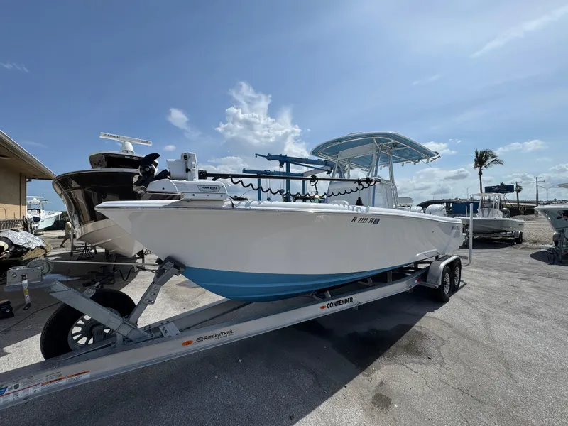 Slide: The Image of 2024 Contender 28 Tournament boat on trailer under clear sky. - 3