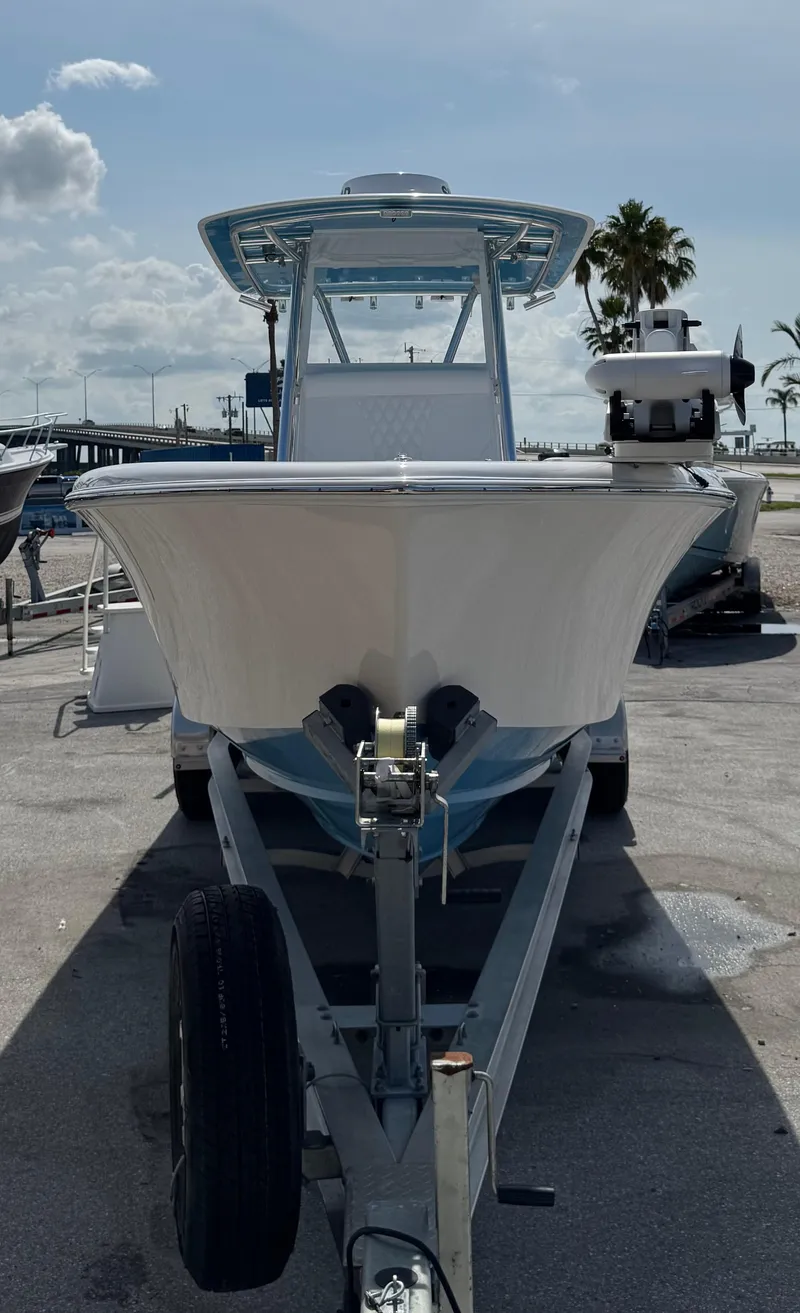 Slide: The Image of 2024 Contender 28 Tournament boat on trailer, sunny day, marina background. - 5