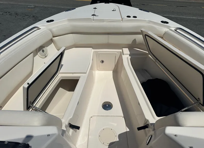 Slide: The Image of 2016 Grady-White Freedom 285 boat interior with open storage compartments. - 12