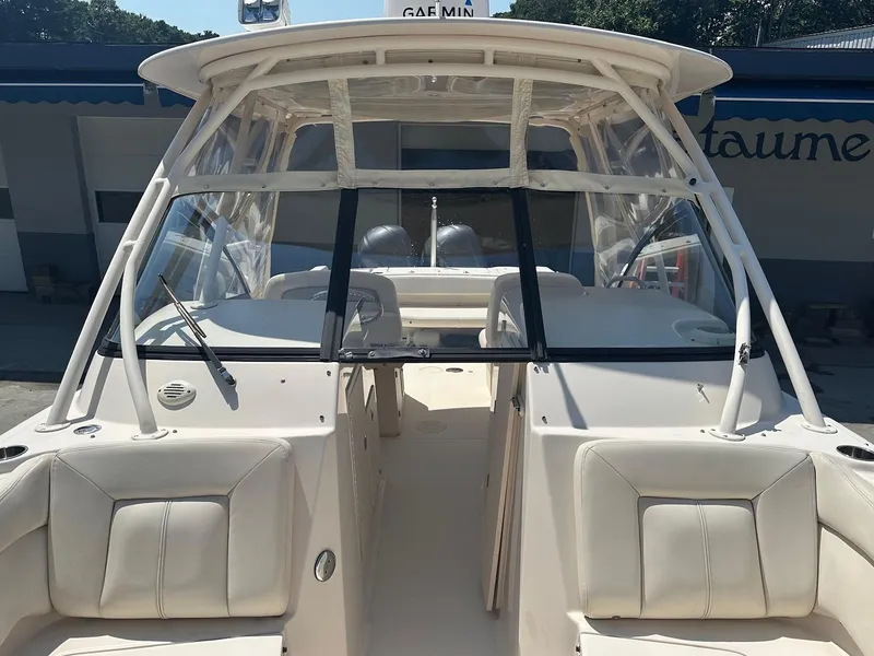 Slide: The Image of 2016 Grady-White Freedom 285 boat interior with seating and windshield. - 13
