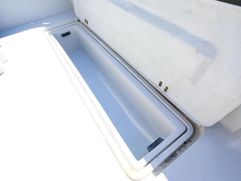 Slide: The Image of Storage compartment on 1997 Luhrs 32 Convertible boat, open and empty. - 10