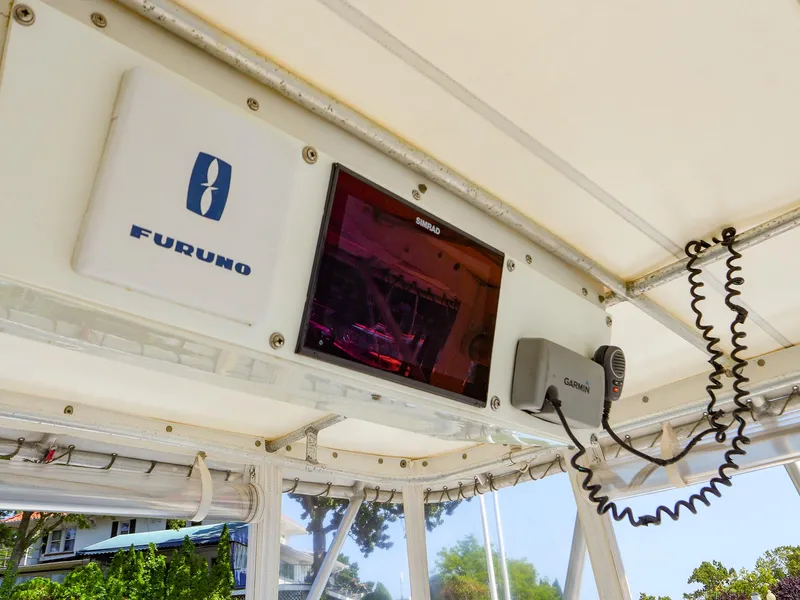 Slide: The Image of 1997 Luhrs 32 Convertible boat electronics, featuring Furuno and Garmin equipment. - 12