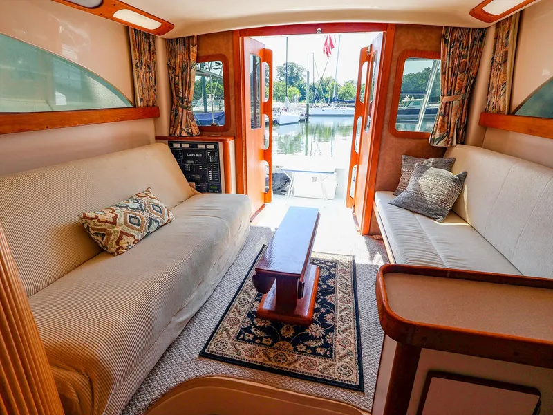 Slide: The Image of Interior of 1997 Luhrs 32 Convertible yacht with cozy seating and elegant decor. - 23