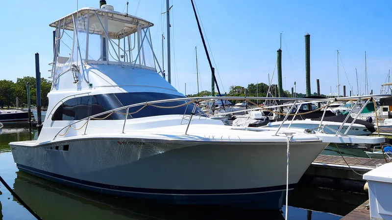 Slide: The Image of 1997 Luhrs 32 Convertible yacht docked at marina. - 31