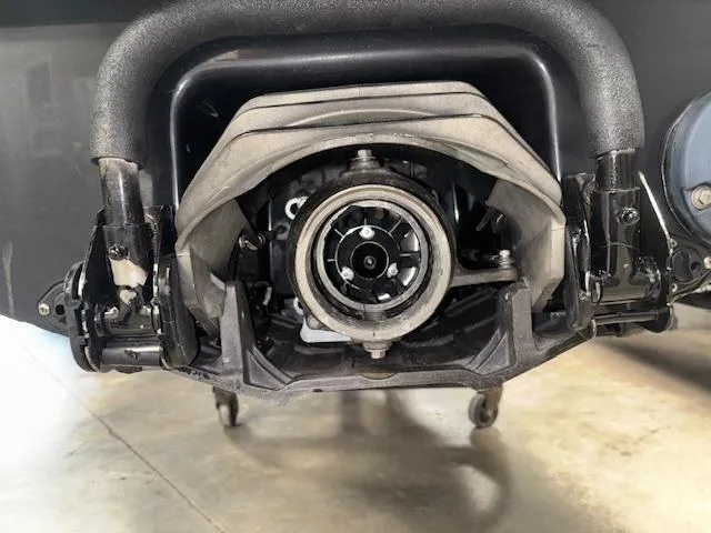 Slide: The Image of 2019 Kawasaki Ultra LX jet ski engine close-up in a garage setting. - 16