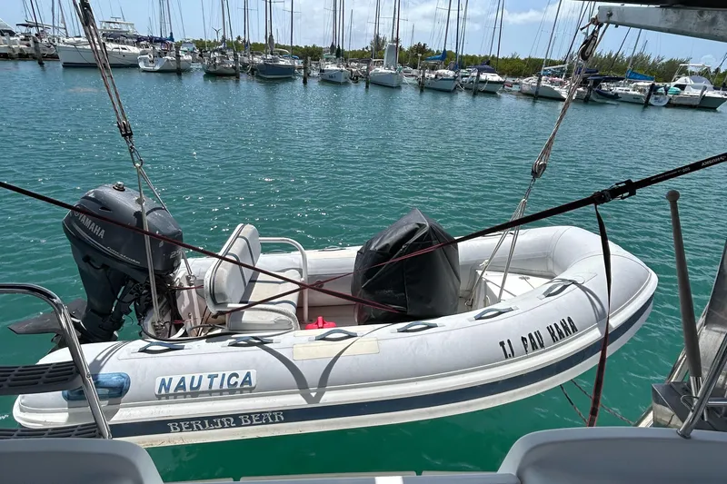 Slide: The Image of Inflatable dinghy with Yamaha motor on Beneteau Cyclades 50.3, 2007, docked in marina. - 10