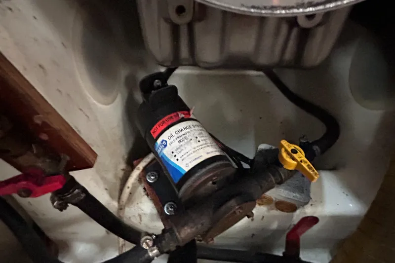 Slide: The Image of Engine compartment of a 2007 Beneteau Cyclades 50.3, featuring an oil change pump. - 17