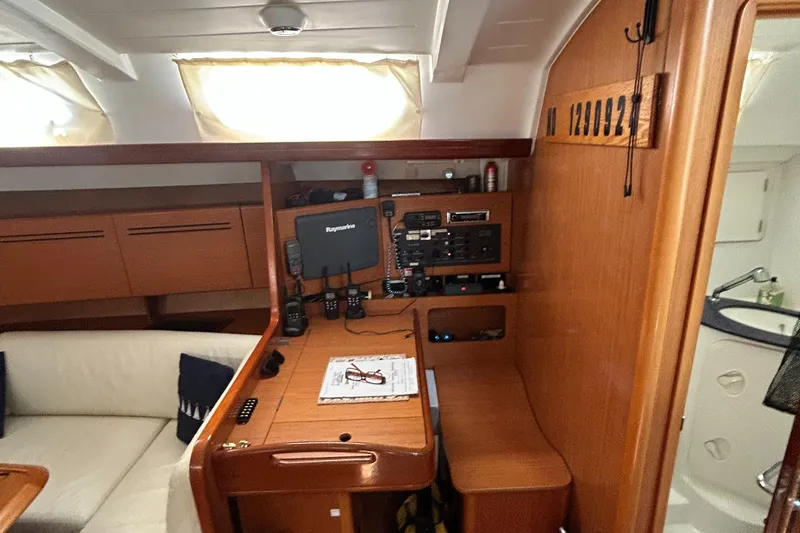 Slide: The Image of Interior of 2007 Beneteau Cyclades 50.3 yacht with navigation station and seating area. - 20
