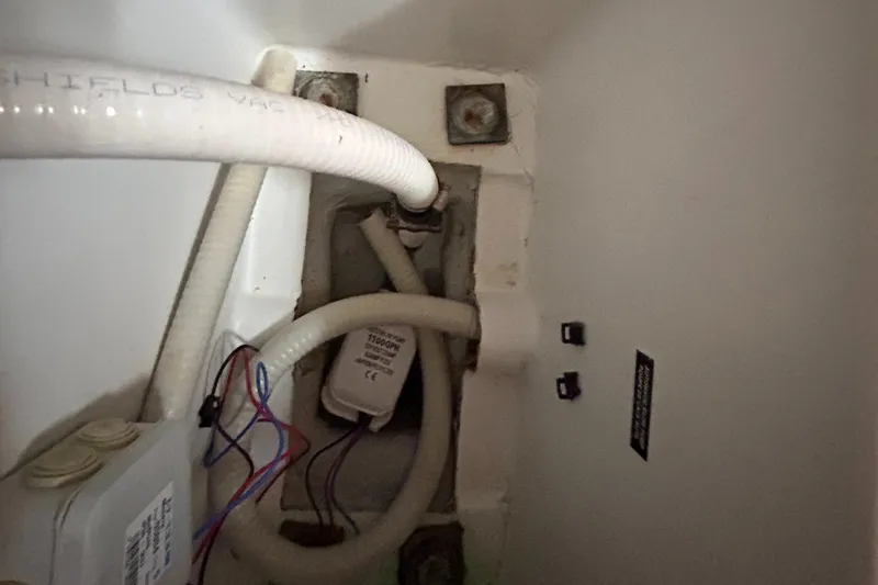 Slide: The Image of Interior view of 2007 Beneteau Cyclades 50.3 yacht showing plumbing and wiring components. - 26