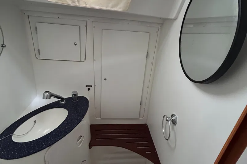Slide: The Image of Bathroom interior of 2007 Beneteau Cyclades 50.3 yacht with sink and mirror. - 27