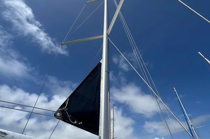 Slide: The Image of Mast of 2007 Beneteau Cyclades 50.3 sailboat against a clear blue sky. - 4