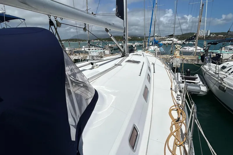 Slide: The Image of Sailing yacht Beneteau Cyclades 50.3, 2007 model, docked in a marina with clear skies. - 5