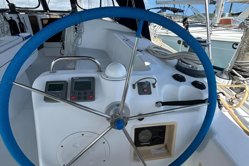 Slide: The Image of Steering wheel and controls of a 2007 Beneteau Cyclades 50.3 sailboat. - 7