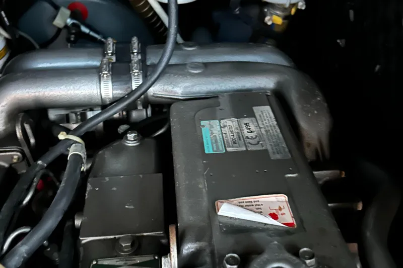 Slide: The Image of Engine compartment of a 2007 Beneteau Cyclades 50.3 sailboat, showing mechanical components. - 9