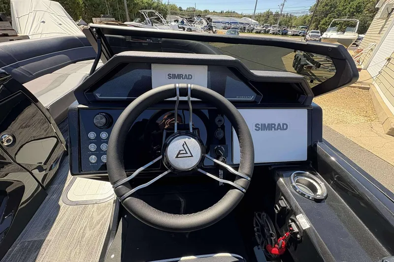 Slide: The Image of Steering wheel and dashboard of 2026 Viaggio Diamante UWA boat with Simrad displays. - 10