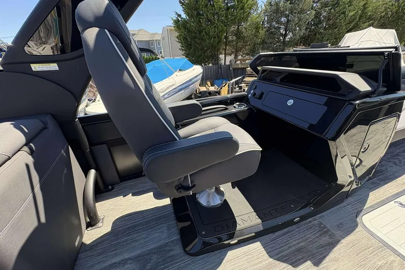 Slide: The Image of Captain's seat and console of 2026 Viaggio Diamante UWA boat, featuring sleek design. - 12