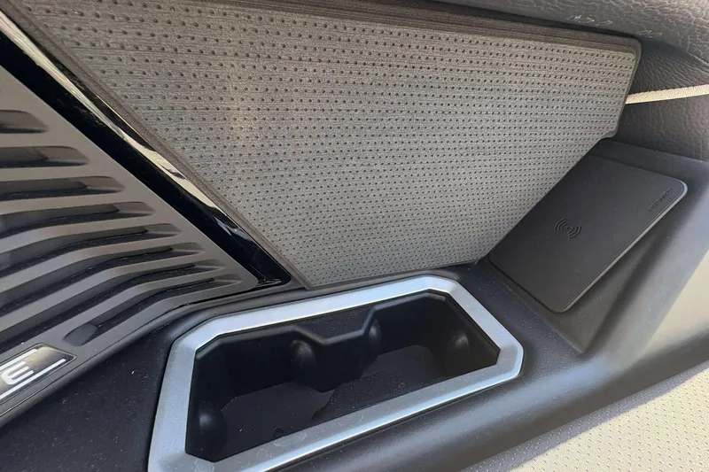 Slide: The Image of Interior detail of 2026 Viaggio Diamante UWA, featuring sleek design and wireless charging pad. - 20