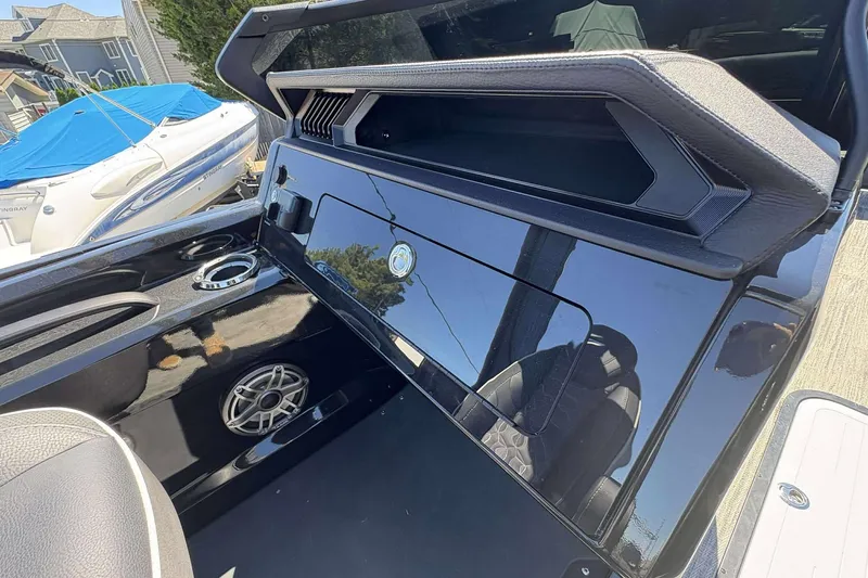 Slide: The Image of 2026 Viaggio Diamante UWA boat interior with sleek black design and speaker system. - 22