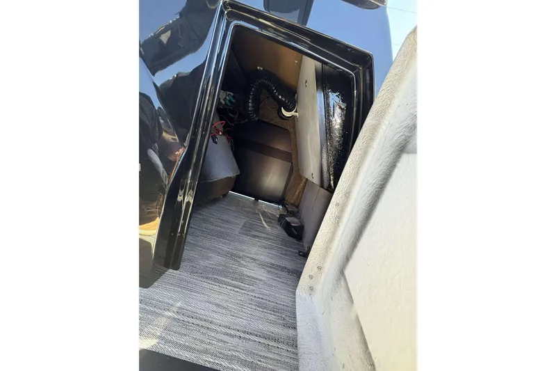 Slide: The Image of Storage compartment of 2026 Viaggio Diamante UWA with carpeted interior and visible wiring. - 26