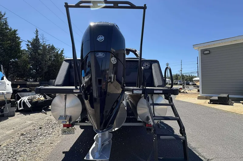 Slide: The Image of 2026 Viaggio Diamante UWA boat with powerful outboard motor and ladder, parked outdoors. - 30