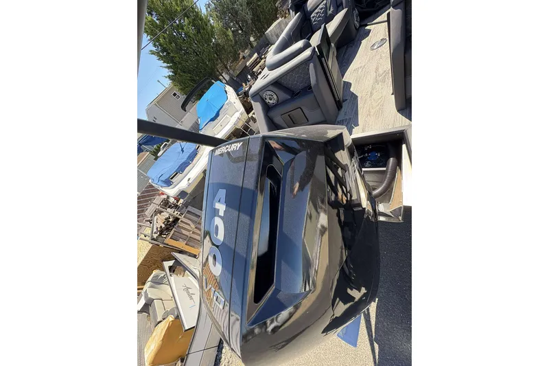 Slide: The Image of 2026 Viaggio Diamante UWA boat with Mercury 400 engine, docked outdoors. - 31