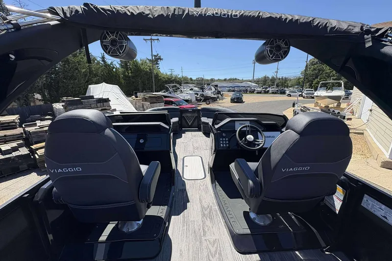 Slide: The Image of Interior of 2026 Viaggio Diamante UWA boat with dual captain chairs and modern dashboard. - 4