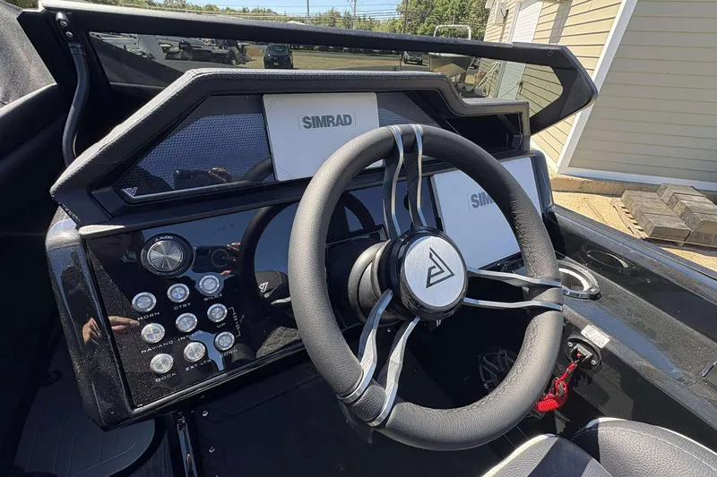 Slide: The Image of Steering wheel and dashboard of 2026 Viaggio Diamante UWA boat with Simrad display. - 8