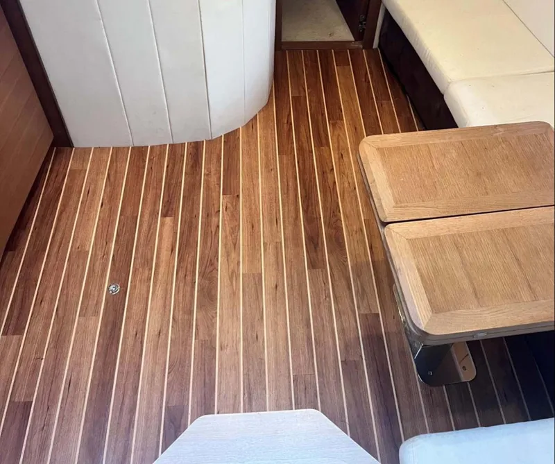 Slide: The Image of Interior of 2011 Azimut Atlantis 40 yacht with wooden flooring and seating area. - 12