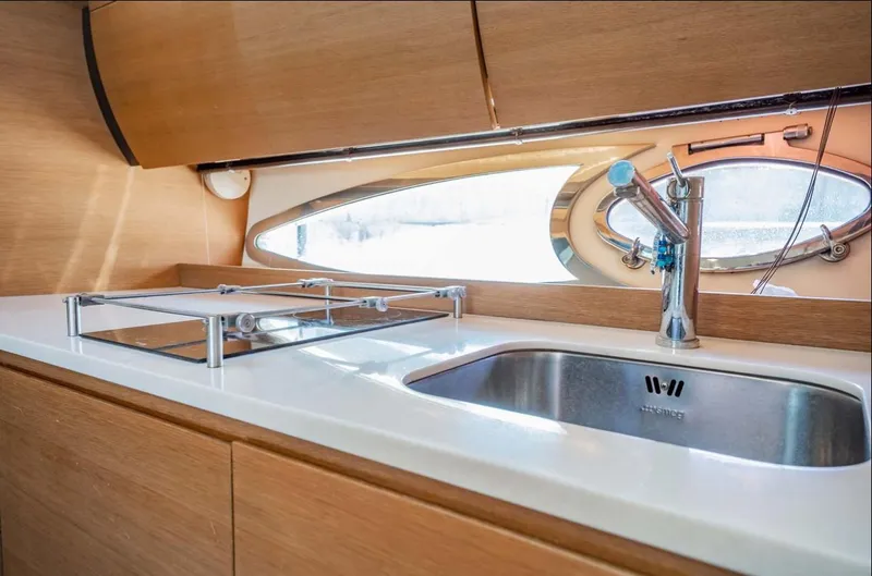 Slide: The Image of Modern kitchen area in 2011 Azimut Atlantis 40 yacht with sink and window. - 13
