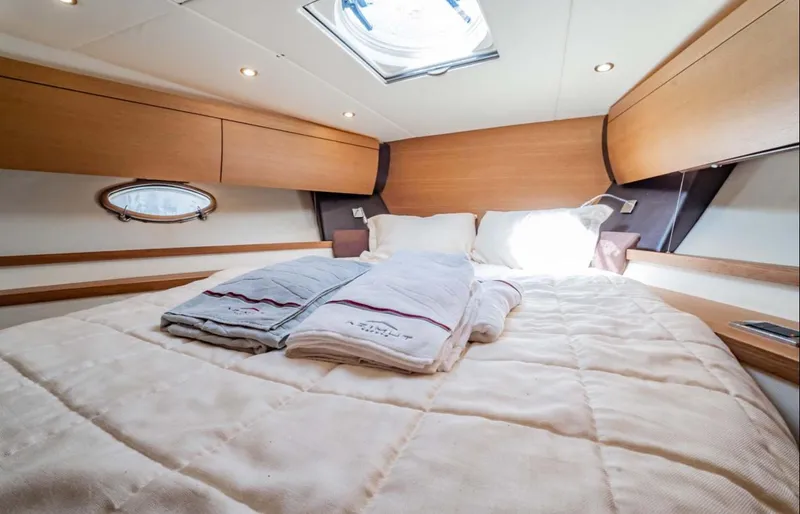 Slide: The Image of Luxurious cabin interior of 2011 Azimut Atlantis 40 yacht with cozy bedding. - 14