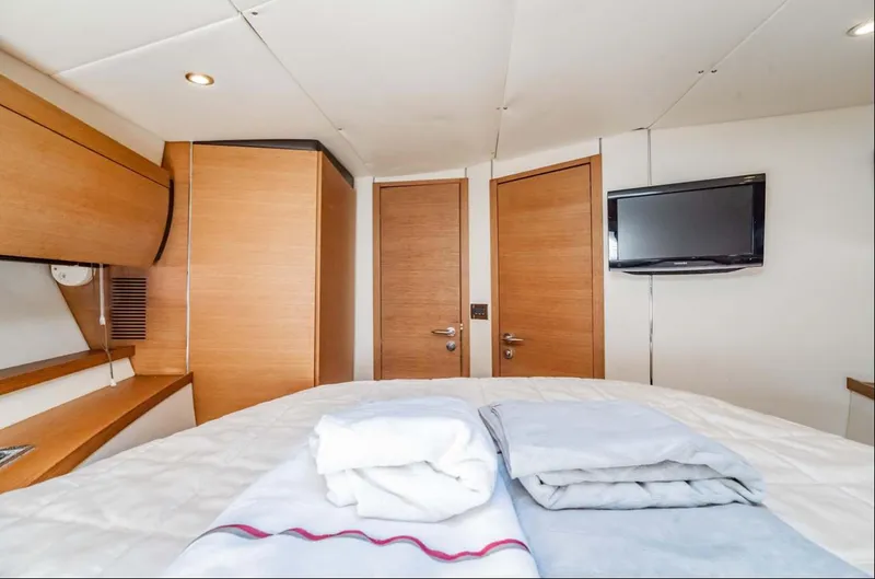 Slide: The Image of Luxurious interior of 2011 Azimut Atlantis 40 yacht with cozy bedding and modern amenities. - 15