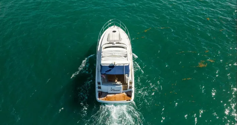 Slide: The Image of Aerial view of 2011 Azimut Atlantis 40 yacht cruising on clear blue water. - 23