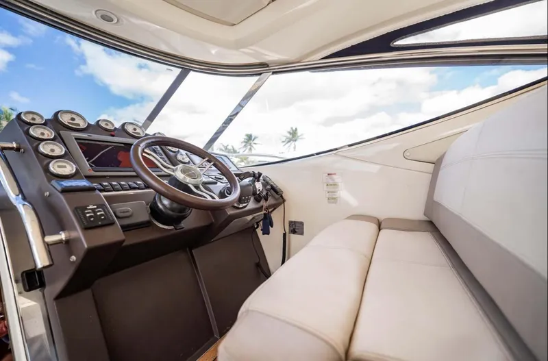 Slide: The Image of Interior view of 2011 Azimut Atlantis 40 yacht cockpit with steering wheel and dashboard. - 24