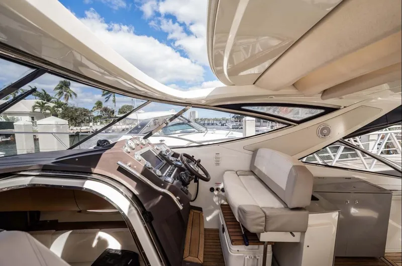 Slide: The Image of Interior view of 2011 Azimut Atlantis 40 yacht with helm and seating area. - 26