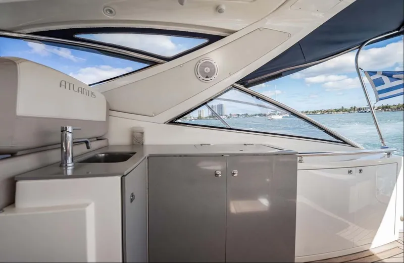 Slide: The Image of Interior view of 2011 Azimut Atlantis 40 yacht with sleek cabinetry and ocean backdrop. - 31