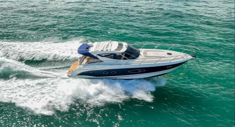 Slide: The Image of 2011 Azimut Atlantis 40 yacht cruising on open water. - 35