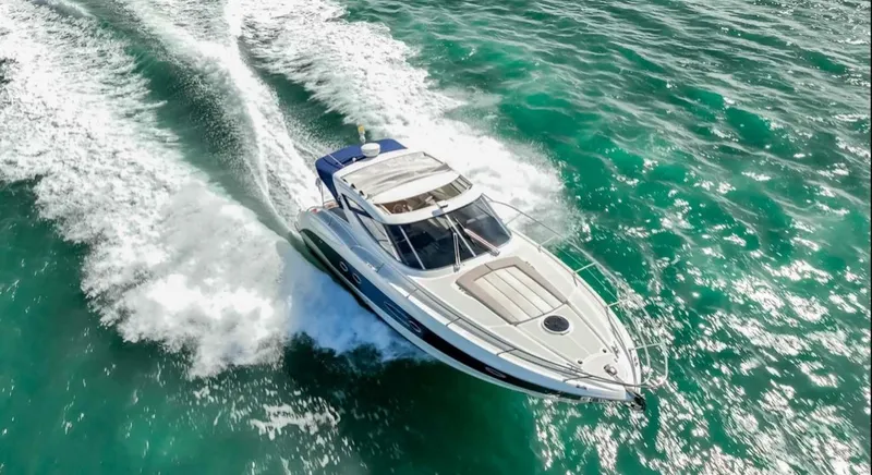 Slide: The Image of Aerial view of 2011 Azimut Atlantis 40 yacht cruising on turquoise waters. - 37