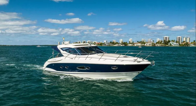 Slide: The Image of Azimut Atlantis 40 yacht cruising on blue waters, city skyline in background, 2011 model. - 39